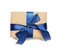 Rectangular box wrapped in brown paper and tied with silk ribbon with a bow Royalty Free Stock Photo