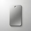 Rectangular brushed metal tag with rounded corners and a small circular hole near the top center. Royalty Free Stock Photo