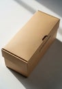 Rectangular cardboard box with a folding lid, placed on a flat surface. The box has a Royalty Free Stock Photo