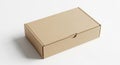 Rectangular cardboard box with a light brown, matte surface, resting on a plain white background. Royalty Free Stock Photo
