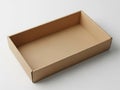 A rectangular cardboard box with an open top on a white surface Royalty Free Stock Photo