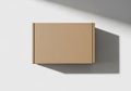 Rectangular cardboard box on a plain white surface. The box is Royalty Free Stock Photo
