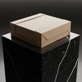Rectangular cardboard box sits on a black marble pedestal with white Royalty Free Stock Photo