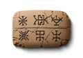 Rectangular clay tablet with ancient cuneiform script, featuring six Royalty Free Stock Photo