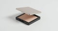 Rectangular compact powder with a sleek, light gray lid, slightly opened to reveal the Royalty Free Stock Photo