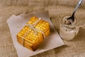 Rectangular crackers and a glass jar of liver pate on sackcloth