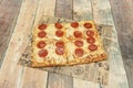 Rectangular diavola pizza divided into portions with the same amount Royalty Free Stock Photo