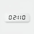 A rectangular digital clock displays \