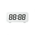 Rectangular digital clock with a white casing displaying \