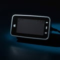 A rectangular electronic device with a sleek black front and a reflective edge is shown. Royalty Free Stock Photo