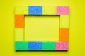 rectangular frame of multicolored sponges on