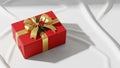 Rectangular gift box adorned with a large shiny gold ribbon and Royalty Free Stock Photo