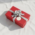 Rectangular gift box adorned with a silver ribbon and bow placed Royalty Free Stock Photo