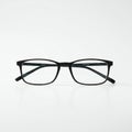 Rectangular glasses with black frames on a white background. The frames are made Royalty Free Stock Photo