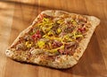 Rectangular gourmet pizza with sausage and colorfu Royalty Free Stock Photo