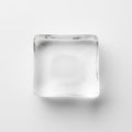 rectangular block of ice, slightly cloudy at the center, resting flat on a white surface Royalty Free Stock Photo