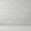 Rectangular marble tiles form a smooth, seamless interior wall and floor. The light Royalty Free Stock Photo