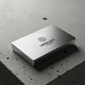 Rectangular metal card with a brushed silver finish, featuring a minimalist geometric Royalty Free Stock Photo