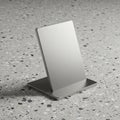 Rectangular metal stand with a brushed silver finish, set at a slight angle on a terrazz Royalty Free Stock Photo