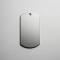 Rectangular metal tag with a smooth, brushed surface and rounded corners. It has a small circular Royalty Free Stock Photo