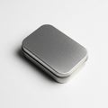 Rectangular metal tin box with rounded edges on a white surface Royalty Free Stock Photo
