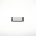 Rectangular metallic component with rounded edges and textured surface Royalty Free Stock Photo