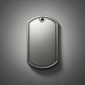 Rectangular metallic dog tag with rounded edges on a dark background. Made of brushed metal, Royalty Free Stock Photo