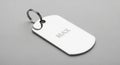 Rectangular metallic dog tag with rounded edges engraved with the name \