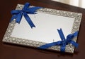 Rectangular mirror framed by an intricate silver design featuring Royalty Free Stock Photo