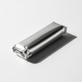 Silver Wrapped Rectangular Object on White Background with Shadow foil wrapper Royalty Free Stock Photo