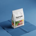Rectangular package labeled Harvest Assorted Groceries sits on a folded blue Royalty Free Stock Photo