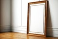 Rectangular picture frame mockup with wooden subframe on light wooden floor