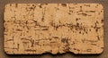 Rectangular piece of cork material with a rough, natural texture. The cork exhibits a Royalty Free Stock Photo