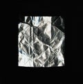 A rectangular piece of crumpled foil. isolated on a black background. Royalty Free Stock Photo