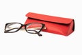 Rectangular plastic oversized eyeglasses with red glasses leather case isolated on a white background Royalty Free Stock Photo