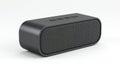 Rectangular portable Bluetooth speaker with rounded edges. Black color with a sleek, matte finish.