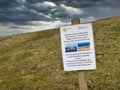 A rectangular, printed sign at Hermaness welcomes visitors to the most northerly part of the UK Royalty Free Stock Photo