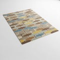 A rectangular rug with a repeating abstract geometric pattern in brown blue and yellow carpet Royalty Free Stock Photo