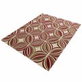 Rectangular Rug with Repeating Geometric Pattern of Red Green and Beige Swirls carpet floor covering Royalty Free Stock Photo