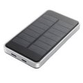 Rectangular silver and black solar powered power bank with dual solar panels portable charger Royalty Free Stock Photo