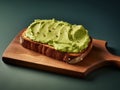 rectangular slice of bread spread with avocado cream