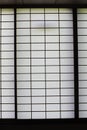 Rectangular and square Japanese shoji paper window frame with partitions with light in Japan Royalty Free Stock Photo