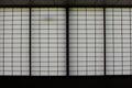 Rectangular and square Japanese shoji paper window frame with partitions with light in Japan Royalty Free Stock Photo