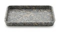 Rectangular stone tray with a speckled pattern, featuring gray and beige tones. The Royalty Free Stock Photo