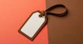 Rectangular Tag with Leather Border on Two- Tone Surface label blank Royalty Free Stock Photo