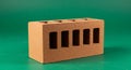 Rectangular terracotta brick with six rectangular holes on a dark green background. Royalty Free Stock Photo