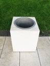 A rectangular trash can in the park. garbage container on green grass. ecology, cleanliness Royalty Free Stock Photo