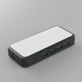 A rectangular USB hub with a sleek design featuring a white top surface and black Royalty Free Stock Photo