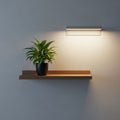 Rectangular wall light casts a soft glow on the light gray wall. Royalty Free Stock Photo