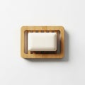 A rectangular white bar of soap rests on a slatted wooden soap dish. The soap dish is made from Royalty Free Stock Photo